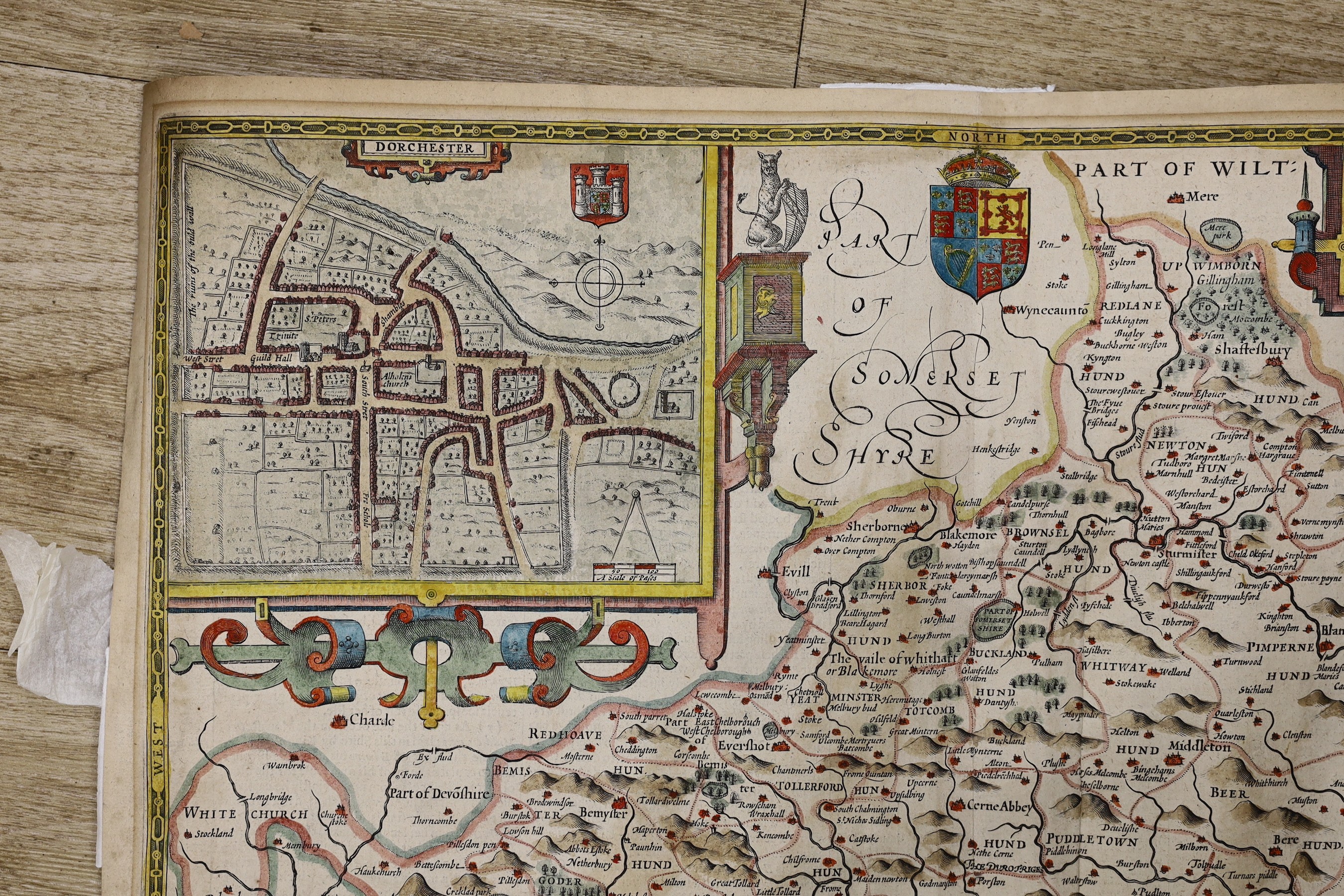John Speed, (1552-1629) Dorsetshyre, hand coloured map, with the Shire-towne Dorchester described, 40.5cm X 53cm